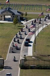 Nearly 1,200 riders depart the Central Texas State Veterans Cemetery following a Nov. 7, 2008, memorial service. The riders participated in a 60-mile safety and mentorship ride. U.S. Army photo by Chris Varville 